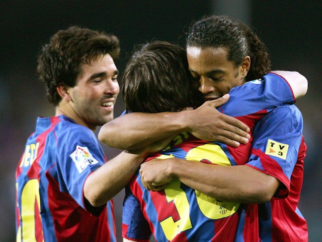 Barcelona's players Ronaldinho, Deco and Messi celebrate after team's second goal against Albacete on May 1, 2005