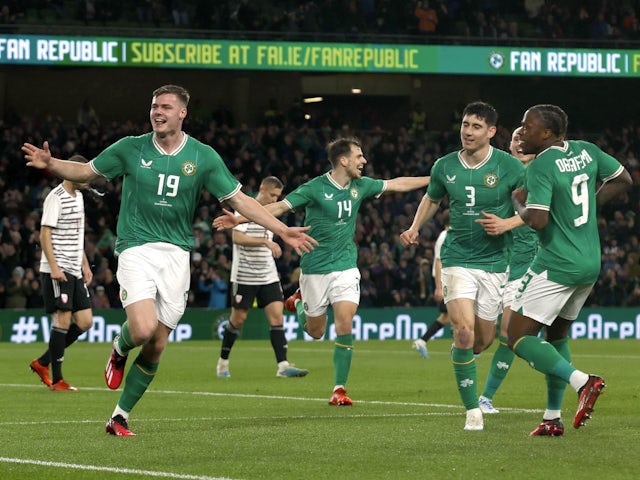 Republic of Ireland's Evan Ferguson celebrates scoring their second goal with teammates on March 22, 2023