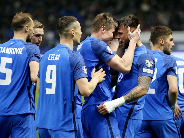 Slovenia's David Brekalo celebrates scoring their first goal with teammates on March 23, 2023