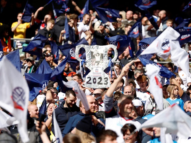  A Bolton Wanderers fan holds up a tin foil replica FA cup inside the stadium before the match on April 2, 2023
