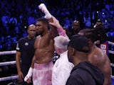 Anthony Joshua has his arm raised by referee Marcus McDonnell after winning his fight against Jermaine Franklin on April 1, 2023