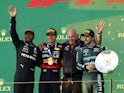 Red Bull's Max Verstappen celebrates on the podium after winning the Australian Grand Prix along with second placed Mercedes' Lewis Hamilton and Aston Martin's Fernando Alonso on April 2, 2023