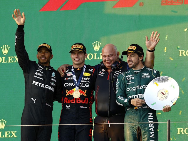 Red Bull's Max Verstappen celebrates on the podium after winning the Australian Grand Prix along with second placed Mercedes' Lewis Hamilton and Aston Martin's Fernando Alonso on April 2, 2023