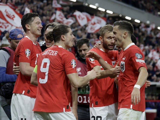 Austria's Michael Gregoritsch celebrates scoring their second goal with teammates on March 24, 2023