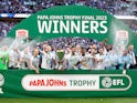 Bolton Wanderers' Ricardo Almeida Santos lifts the trophy with teammates after they won the EFL Trophy Final on April 2, 2023