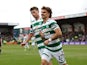 Celtic's Jota celebrates scoring their first goal with Matt O'Riley on April 2, 2023