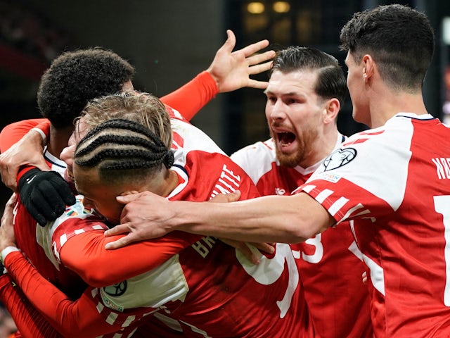 Denmark's Rasmus Hojlund celebrates scoring their first goal with teammates on March 23, 2023