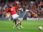 Nottingham Forest's Emmanuel Dennis in action with Wolverhampton Wanderers' Adama Traore on April 1, 2023