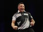 Gerwyn Price celebrates victory over Chris Dobey during their semi final match on March 23, 2023