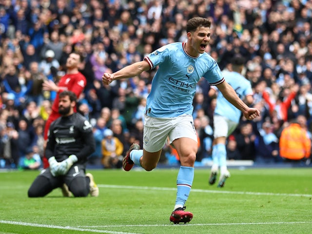 Manchester City's Julian Alvarez celebrates scoring their first goal on April 1, 2023