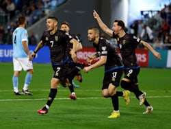 Kosovo players celebrate their first goal after Israel's Eli Dasa scores an own goal on March 25, 2023