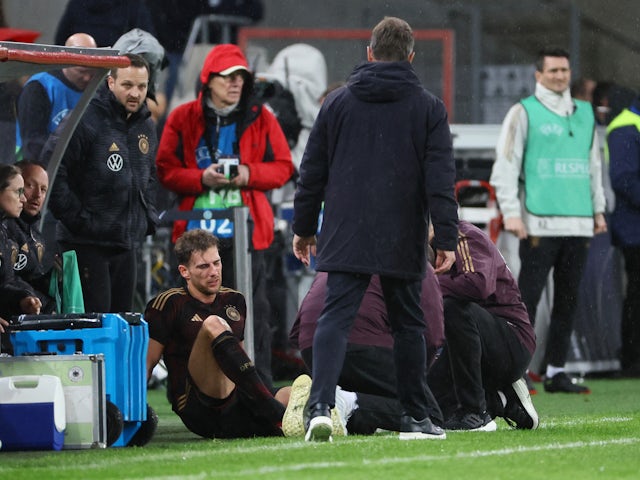 Germany's Leon Goretzka receives medical attention after sustaining an injury on March 28, 2023