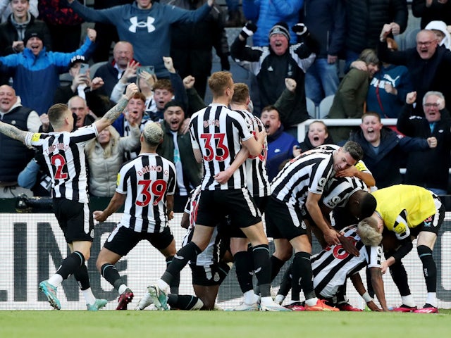 Newcastle United's Joe Willock celebrates scoring their first goal with teammates on April 2, 2023