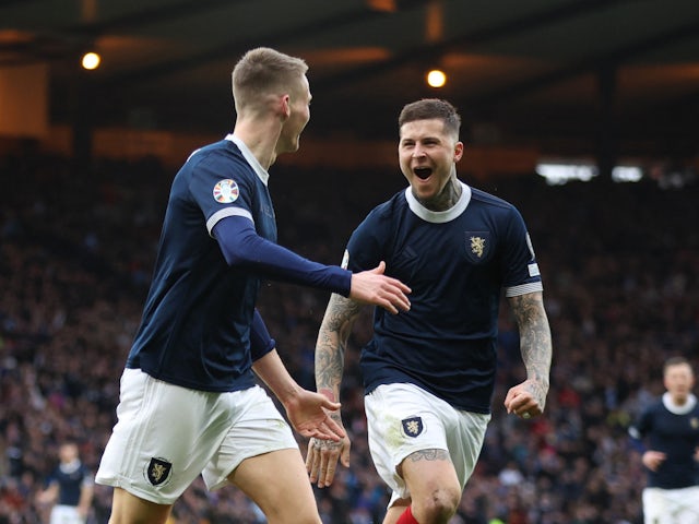 Scotland's Scott McTominay celebrates scoring their second goal with Lyndon Dykes on March 25, 2023