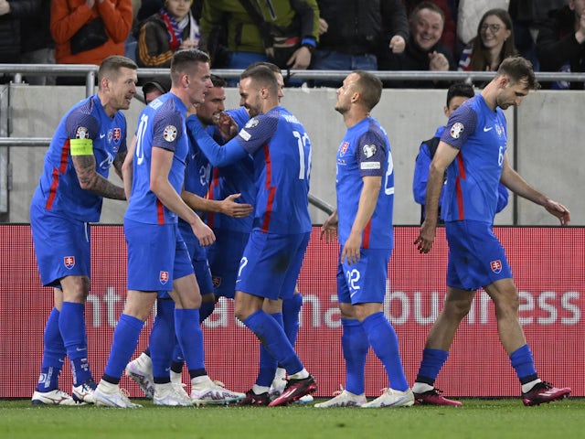 Slovakia's Robert Mak celebrates scoring their first goal with teammates on March 26, 2023