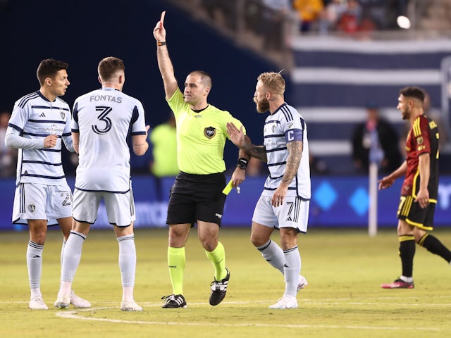 Referee shows a red card to Sporting Kansas City defender Ben Sweat on March 25, 2023