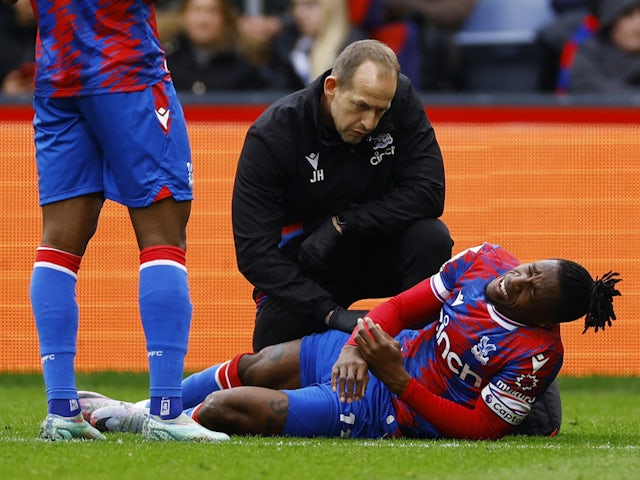 Crystal Palace's Wilfried Zaha reacts after sustaining an injury on April 1, 2023