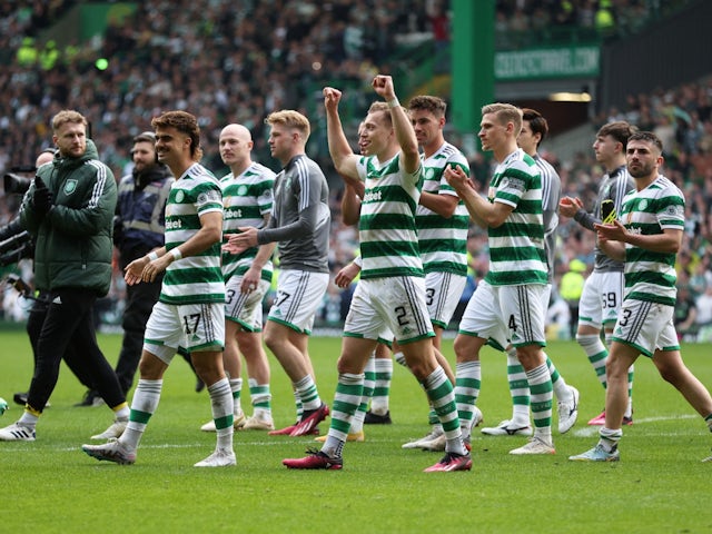 Celtic's Alistair Johnston and teammates celebrate after the match on April 8, 2023