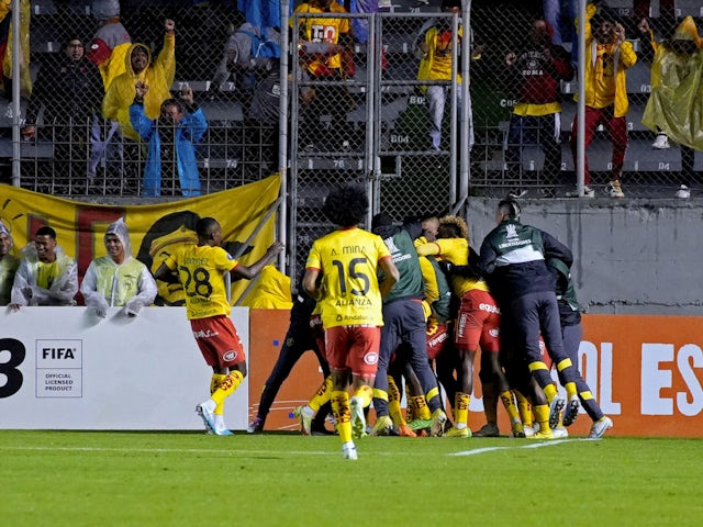 Aucas' Roberto Ordonez celebrates scoring their second goal with teammates on April 5, 2023