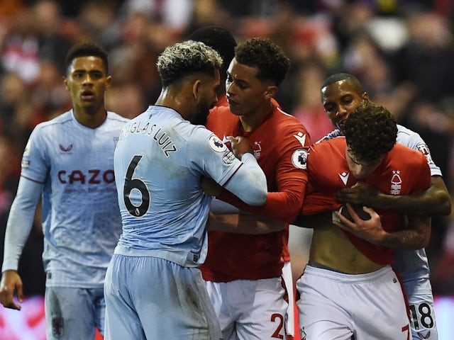 Aston Villa's Douglas Luiz clashes with Nottingham Forest's Brennan Johnson as Nottingham Forest's Neco Williams is restrained by Aston Villa's Ashley Young on October 10, 2022