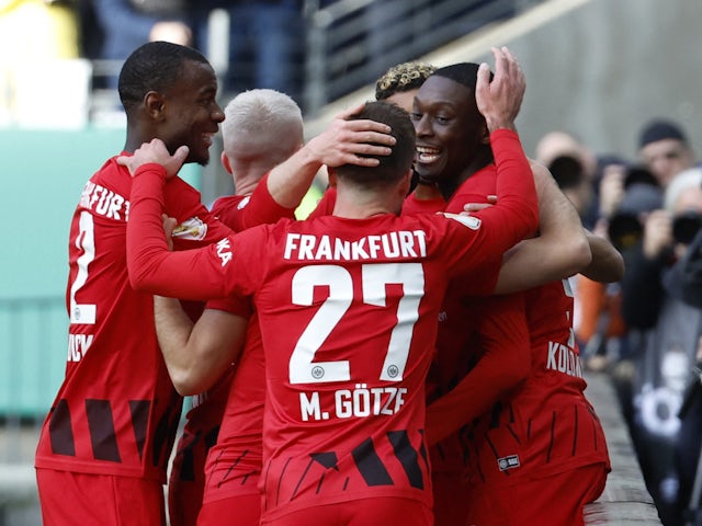 Eintracht Frankfurt's Randal Kolo Muani celebrates scoring their second goal with teammates on April 4, 2023