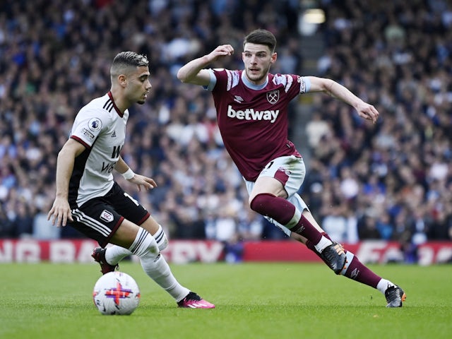 Fulham's Andreas Pereira in action with West Ham United's Declan Rice on April 8, 2023