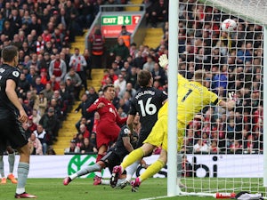 Liverpool net late equaliser in thrilling draw with leaders Arsenal