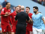 Liverpool players remonstrate with referee Simon Hooper on April 1, 2023