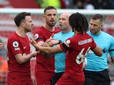 Liverpool players remonstrate with referee Paul Tierney on April 9, 2023
