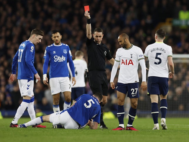 Tottenham Hotspur's Lucas Moura is shown a red card by referee David Coote on April 3, 2023