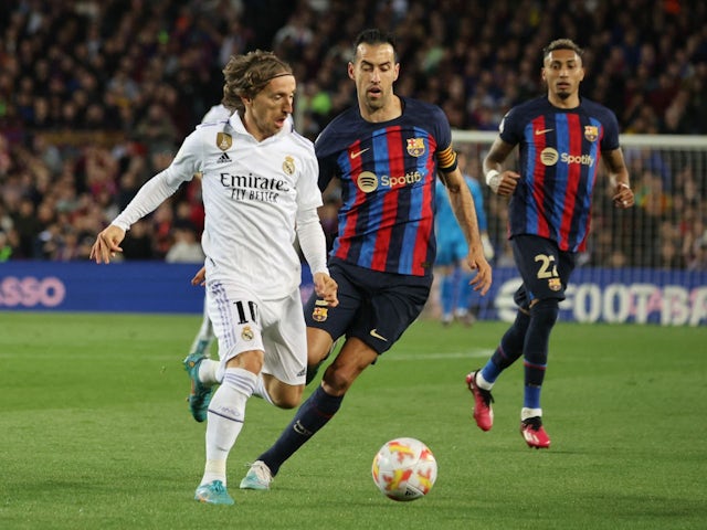 Real Madrid's Luka Modric in action with FC Barcelona's Sergio Busquets on April 5, 2023