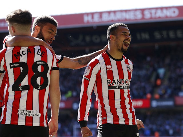 Sheffield United's Iliman Ndiaye celebrates with teammates after scoring their first goal on April 7, 2023