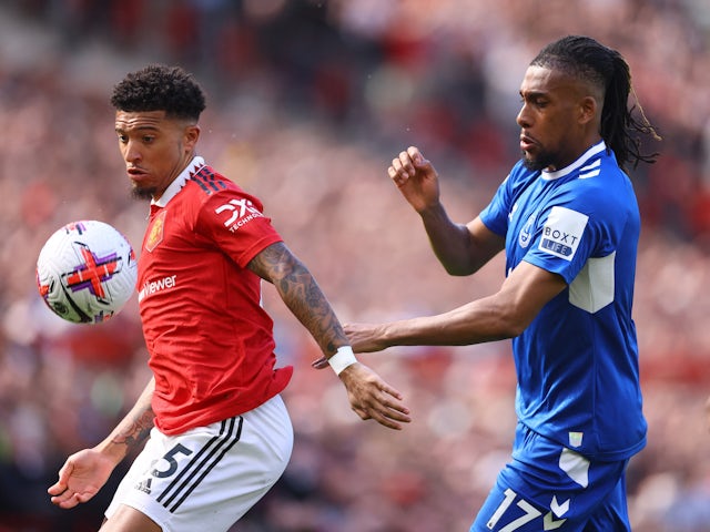 Manchester United's Jadon Sancho in action with Everton's Alex Iwobi on April 8, 2023