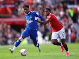 Everton's Demarai Gray in action with Manchester United's Tyrell Malacia on April 8, 2023