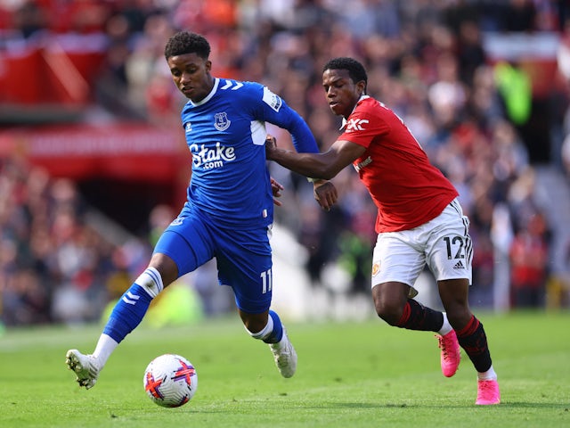 Everton's Demarai Gray in action with Manchester United's Tyrell Malacia on April 8, 2023