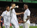 Real Madrid's Vinicius Jr celebrates scoring their first goal with Real Madrid's Karim Benzema on April 5, 2023