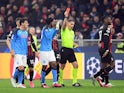 Napoli's Andre-Frank Zambo Anguissa is shown a red card by referee Istvan Kovacs on April 12, 2023
