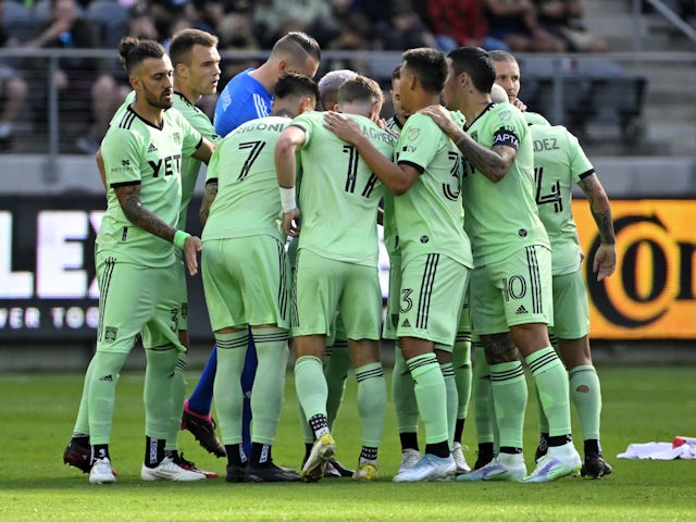 Austin FC players huddle on the field prior to the game on April 9, 2023