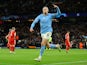 Manchester City's Erling Braut Haaland celebrates scoring their third goal on April 11, 2023