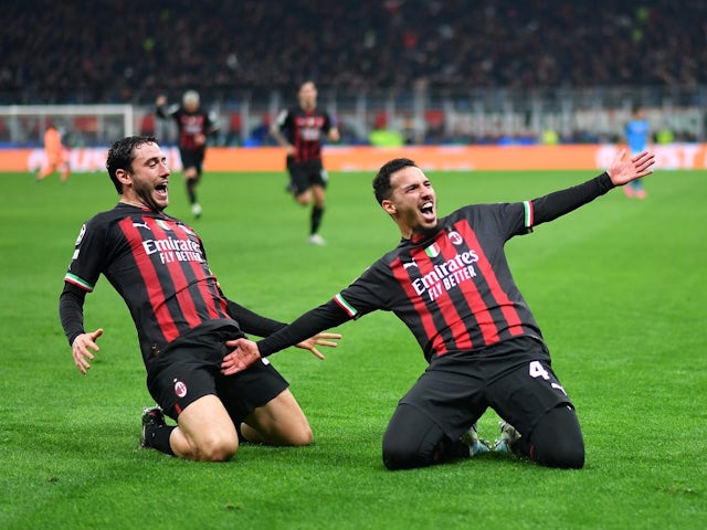 AC Milan's Ismael Bennacer celebrates scoring their first goal with Davide Calabria on April 12, 2023