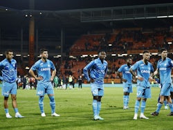 Marseille players look dejected after the match on April 9, 2023