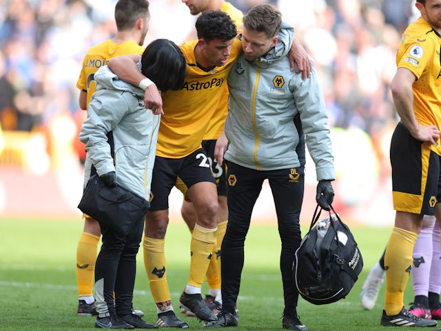 Wolverhampton Wanderers' Matheus Nunes receives medical attention after sustaining an injury on April 8, 2023