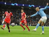 Manchester City's Erling Braut Haaland shoots at goal against Bayern Munich on April 11, 2023