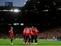 Manchester United players celebrate Marcel Sabitzer's goal against Sevilla on April 14, 2023