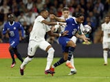 Chelsea's Raheem Sterling in action with Real Madrid's David Alaba and Federico Valverde on April 12, 2023