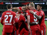 Bayer Leverkusen's Mitchel Bakker celebrates scoring their second goal with teammates on April 20, 2023