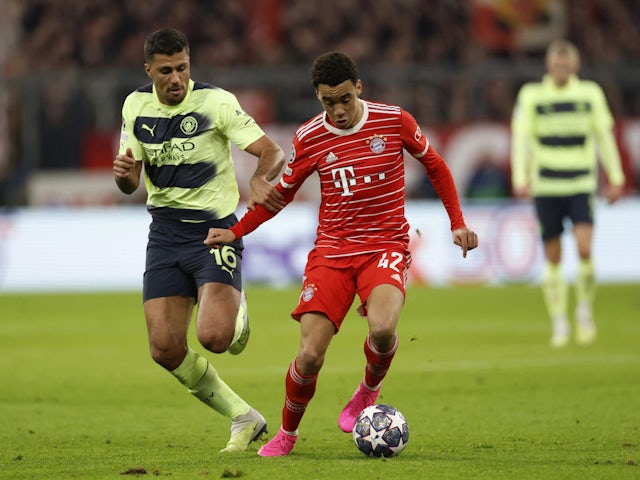 Bayern Munich's Jamal Musiala in action with Manchester City's Rodri on April 19, 2023