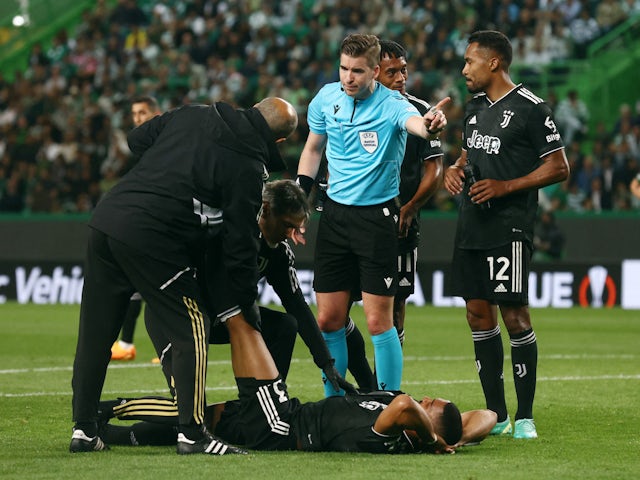 Juventus' Bremer receives medical attention after sustaining an injury on April 20, 2023
