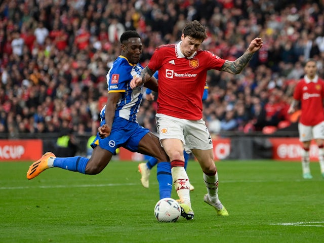 Brighton & Hove Albion's Danny Welbeck in action with Manchester United's Victor Lindelof on April 23, 2023