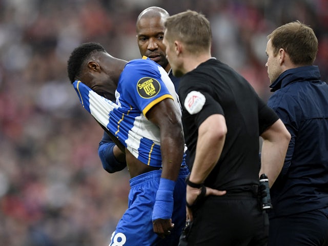 Brighton & Hove Albion's Danny Welbeck looks dejected as he walks off the pitch after sustaining an injury on April 23, 2023